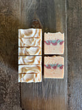 White, red and green soaps with red specks inside.
