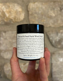 Image shows jar of charcoal face scrub