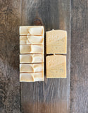yellow and white soaps with poppyseeds inside